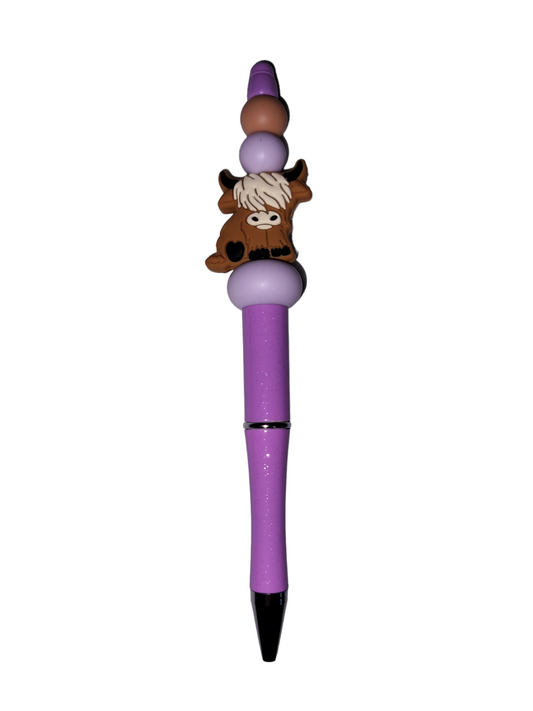 Highland cow writing pen